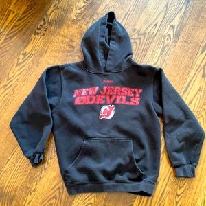 2/$25 back to school sale.  Devils hoodie official nhl brand. Size medium.